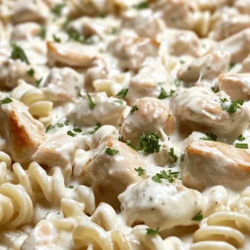 Welcome to the delicious world of Creamy Garlic Butter Chicken & Rotini in Parmesan Sauce, a dish that tantalizes your taste buds and warms your heart. This recipe is a delightful blend of tender chicken, al dente rotini pasta, and a rich, creamy sauce that makes each bite feel like a comforting hug. The combination of flavors and textures in this dish creates a symphony of satisfaction, making it an ideal choice for both a quick weeknight dinner and a special occasion.