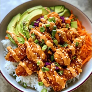 The Bang Bang Chicken Bowl is a culinary masterpiece that combines the irresistible crunch of fried chicken with a medley of vibrant vegetables, all drizzled with a creamy, spicy sauce. This dish not only tantalizes your taste buds but also offers a feast for the eyes with its colorful presentation. Perfect for family dinners, meal prep, or casual gatherings, the Bang Bang Chicken Bowl is a versatile recipe that fits a variety of occasions. Whether you’re looking to impress guests or simply enjoy a satisfying meal at home, this dish promises to deliver on both flavor and satisfaction.