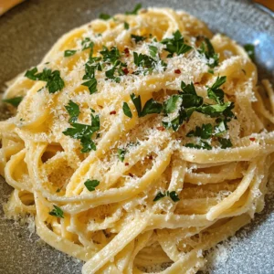 Garlic Parmesan Pasta is a dish that embodies comfort and indulgence, marrying the rich flavors of garlic and cheese with the satisfying texture of pasta. Whether you are a busy professional looking for a quick weeknight meal or a culinary enthusiast seeking to impress your dinner guests, this recipe fits the bill perfectly. The appeal of Garlic Parmesan Pasta lies not only in its tantalizing taste but also in its simplicity and speed of preparation. In just under 30 minutes, you can create a gourmet meal that feels like a luxurious treat.